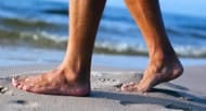 Why do my feet get sore after walking on the beach?